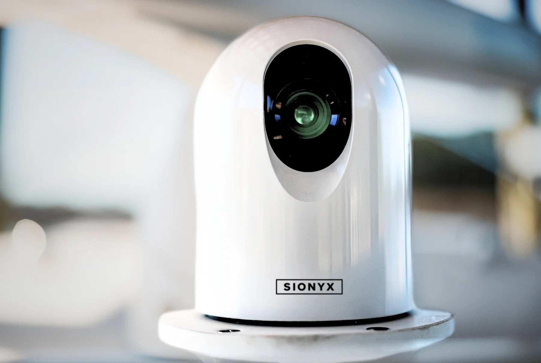 White SIONYX Nightwave Digital marine night vision camera mounted on a boat